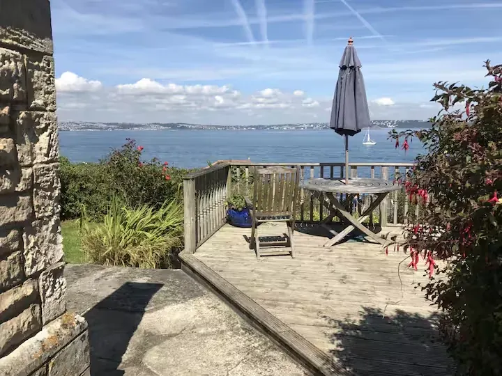 The sunny deck and open Torbay view at Sealark Cottage