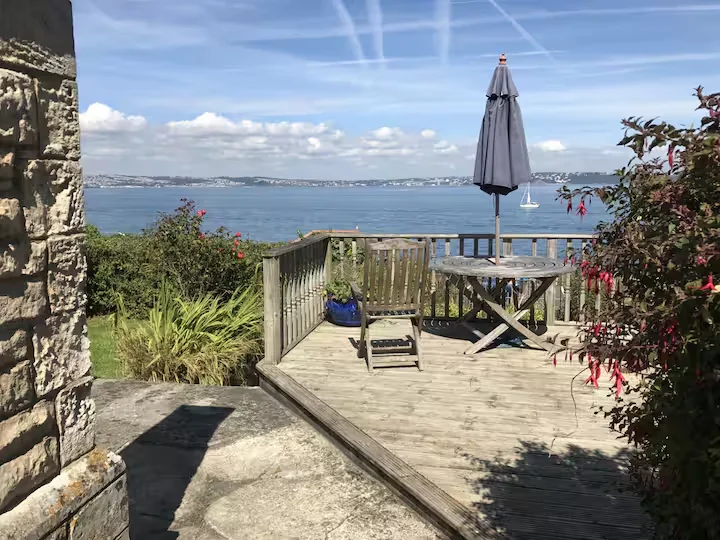 The sunny deck and sea view at Sealark Cottage